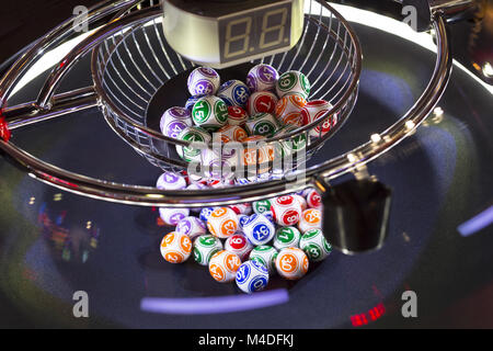 Colourful lottery balls in a machine Stock Photo