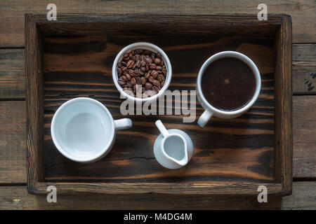 Cups of coffee on dark wooden background. Stock Photo