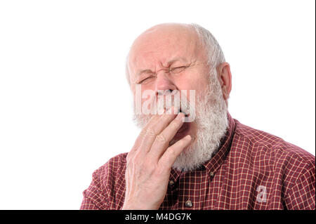 Senior man yawning, isolated on white