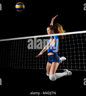 Young woman volleyball player isolated on black Stock Photo