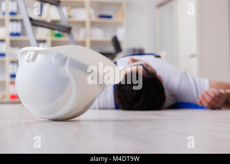 Worker after falling from height - unsafe behavior Stock Photo