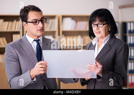Business couple discussing business results on tablet Stock Photo