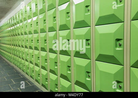 Rows of green student lockers in school hall Stock Photo