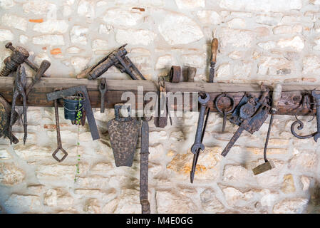 Old rusty tools seen in an old workshop Stock Photo
