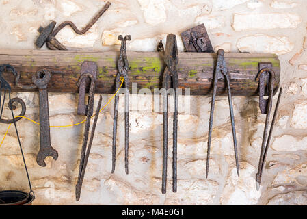 Rusty old tools seen in an old workshop Stock Photo