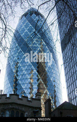 Colour Photograph of The Gherkin, 30 St Mary Axe (informally known as the Gherkin and previously as the Swiss Re Building) Skyscraper, City of London. Stock Photo