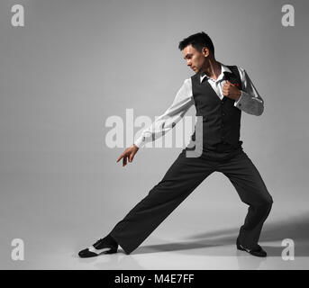 Young male professional dancer dancing in studio. Stock Photo