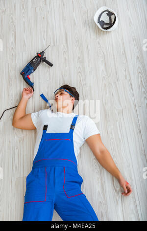 Worker after falling from height - unsafe behavior Stock Photo