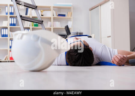 Worker after falling from height - unsafe behavior Stock Photo