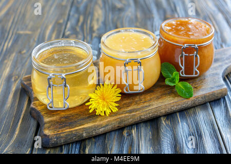 Different varieties of honey in a glass jars. Stock Photo
