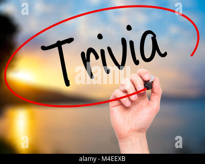 Man Hand writing Trivia with black marker on visual screen Stock Photo