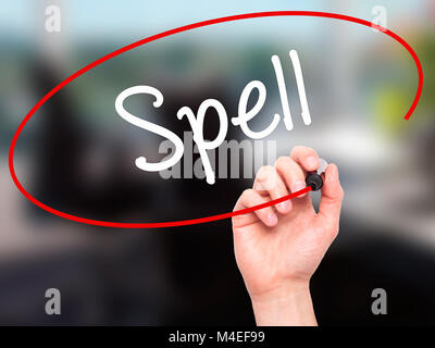 Man Hand writing Spell with black marker on visual screen Stock Photo