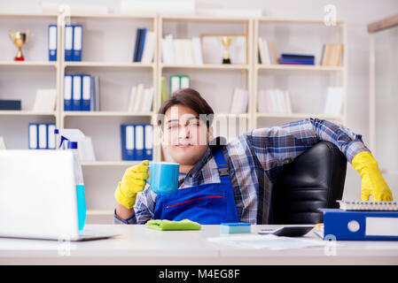 Male cleaner working in the office Stock Photo