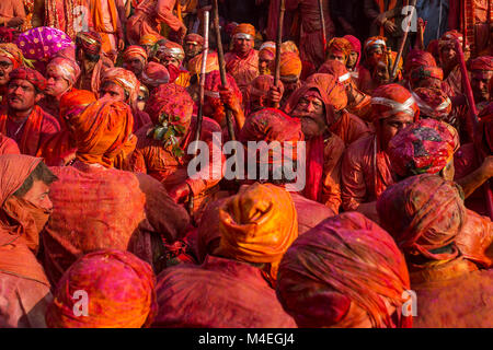 Nandgaon, India - March 18, 2016: Barsana villagers come to Nandgaon village to celebrate Lathmar Holi in Nandgaon, Uttar Pradesh, India. Stock Photo
