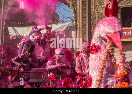 Mathura, India - March 23, 2016: Colourful Holi procession on the streets of Mathura, Uttar Pradesh, India. Stock Photo