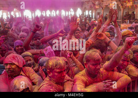 Barsana, India - March 17, 2016: Hindu devotees celebrate Lathmar Holi in Barsana village, Uttar Pradesh, India. Stock Photo