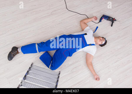 Worker after falling from height - unsafe behavior Stock Photo