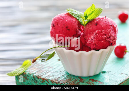 Homemade cherry ice cream in a ceramic bowl. Stock Photo
