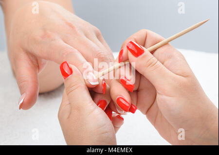 Cuticles care with cuticle pusher Stock Photo