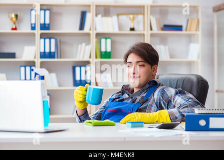 Male cleaner working in the office Stock Photo