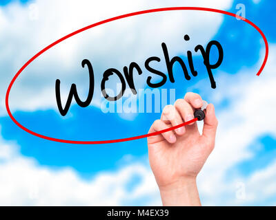 Man Hand writing Worship with black marker on visual screen Stock Photo