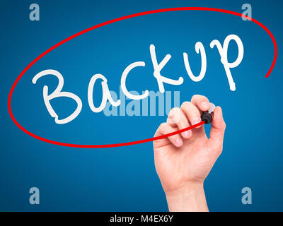 Man Hand writing Backup with marker on transparent wipe board Stock Photo