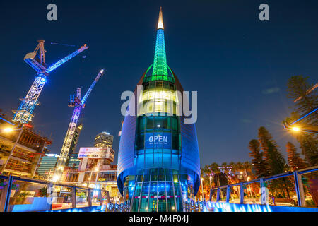 Perth, Australia - Jan 5, 2018: Bell Tower or Swan Bell Tower and construction cranes illuminated by night lights in Perth city, Western Australia. The Barrack Square area is still under construction. Stock Photo