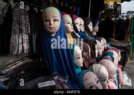 Chris Huby / Le Pictorium -    -  02/02/2018  -  France / Yvelines (french department) / Trappes  -  France - Trappes - Marche des meurisiers - Muslim veils for woman on a shop - The city of Trappes is the embodiment of a paradox: at the same time place of origin of the most popular French actor in 2017, Omar Sy, symbol of integration, and place of departure of 67 trappists fighting in the Islamic State in the Levant (ISIS / DAESH), symbol of rupture. In addition, she holds the European record for starting jihad. Stock Photo