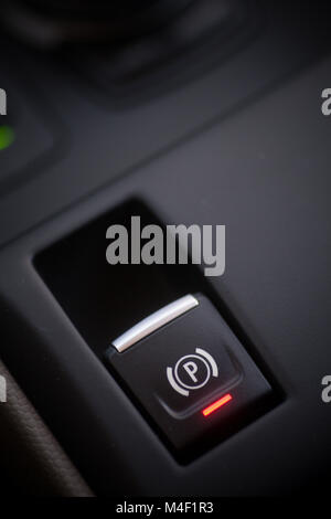 Close up shot of a parking brake button in a car. Stock Photo