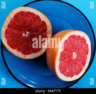 Grapefruit halves close-up on a plate Stock Photo