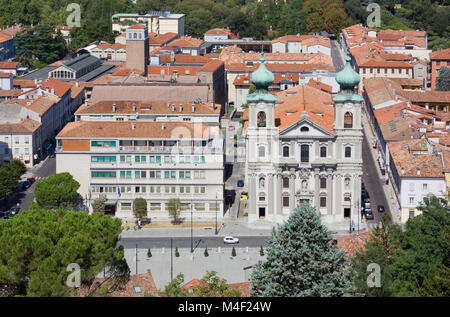 Piazza della Vittoria in Gorizia, Italy, seen from the castle, with the church of Sant'Ignazio in the foreground Stock Photo