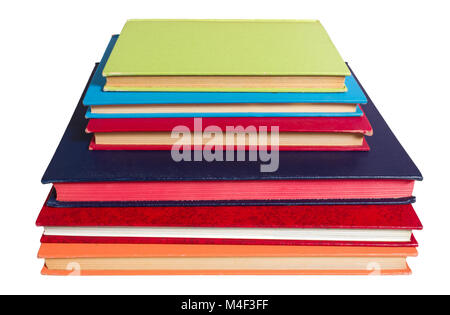 Six isolated piled colored books Stock Photo