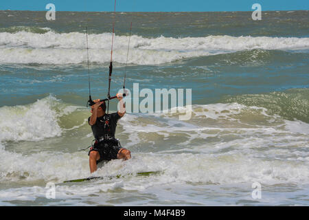 A Kite Boarder navigating the surf Stock Photo