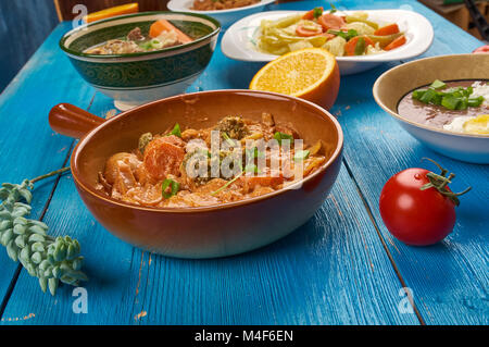 East African cuisine - Ethiopian Inspired Berbere Chicken Curry, Traditional assorted African  dishes, Top view. Stock Photo