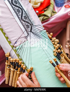 Top view of an elderly woman working on bobbin lace Stock Photo