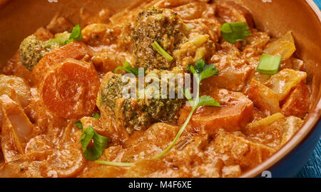 East African cuisine - Ethiopian Inspired Berbere Chicken Curry, Traditional assorted African  dishes, Top view. Stock Photo