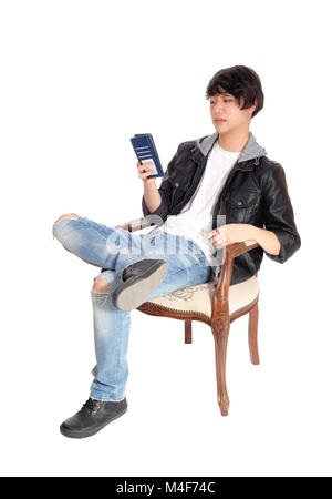 Asian man talking on his cellphone. Stock Photo