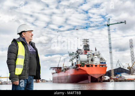 Shipbuilding engineer at the dockside in a port. Stock Photo