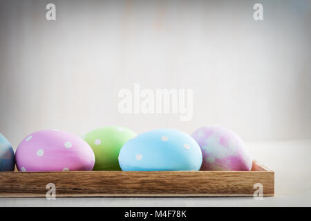 Row Of Easter Eggs On Table. Colorful Easter Decoration Stock Photo - Alamy