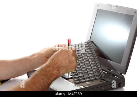 man is repairing a notebook Stock Photo