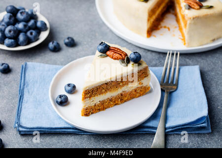 Vegan, raw carrot cake on a plate. Healthy food. Stock Photo