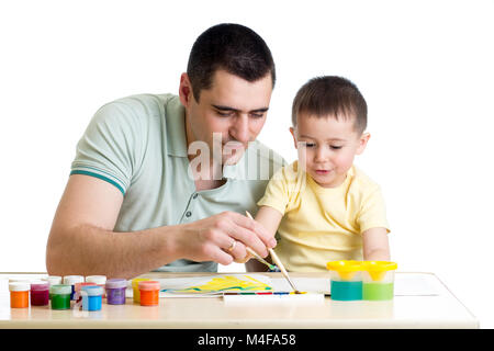 young smiling father painting with son Stock Photo