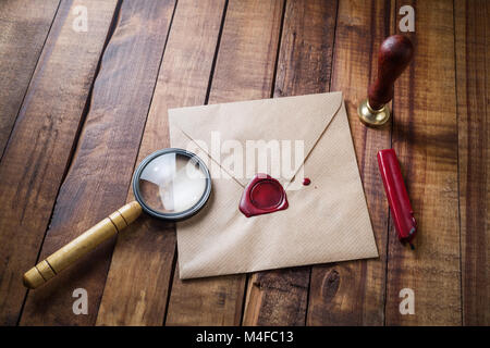 Envelope, magnifier, seal Stock Photo