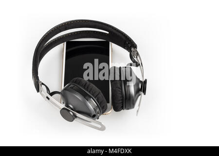 wireless headphones on mobile phone Stock Photo