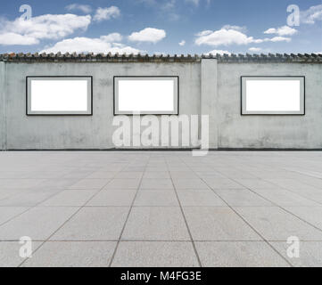 blank frame on wall with blue sky Stock Photo