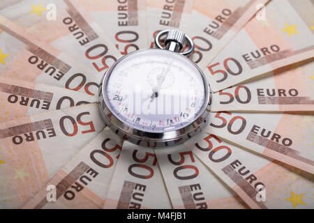 High Angle View Of A Stopwatch On Euro Notes Stock Photo