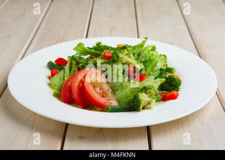 Fresh spring green salad, beans, tomato and broccoli Stock Photo