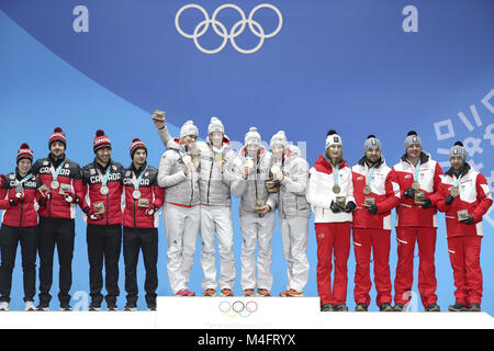 Pyeongchang, South Korea. 16th Feb, 2018. Members of champion team Germany (C), second-placed Canada (L) and third-placed Austria pose for photos during medal ceremony of team relay competition of luge at 2018 PyeongChang Winter Olympic Games at Medal Plaza, PyeongChang, South Korea, Feb. 16. 2018. Credit: Bai Xuefei/Xinhua/Alamy Live News Stock Photo