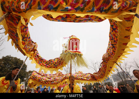 Bozhou, China's Anhui Province. 16th Feb, 2018. Farmers prepare to perform dragon dance in Mengcheng County, east China's Anhui Province, Feb. 16, 2018. People held different activities to celebrate Chinese Lunar New Year all over China. Credit: Hu Weiguo/Xinhua/Alamy Live News Stock Photo