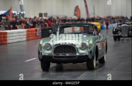 ExCel, London. 16 February 2018. Visitors flock to The London Classic Car Show, expanded this year to fill one side of the vast ExCel exhibition venue with Le Mans winners, Grand Prix racers, classic supercars and century-old veterans in action all under one roof. The second Historic Motorsport International Show opens alongside, both from 15-18 Feb 2018. Credit: Malcolm Park/Alamy Live News. Stock Photo